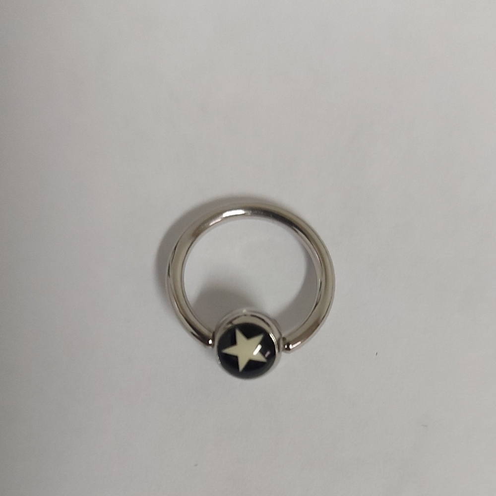 Silver Ring with Black Star Design